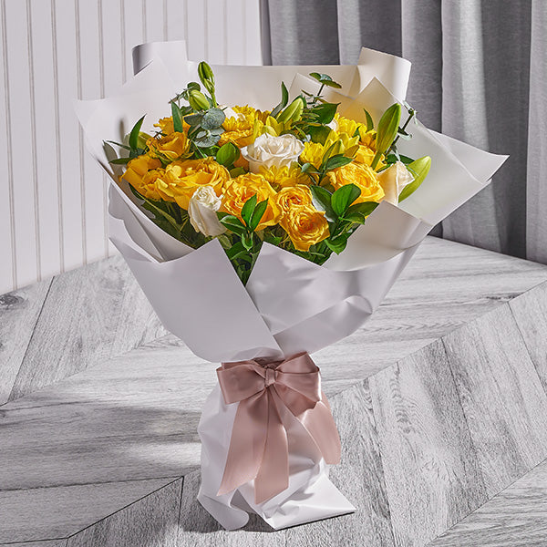 Neutral-toned sympathy flower arrangement