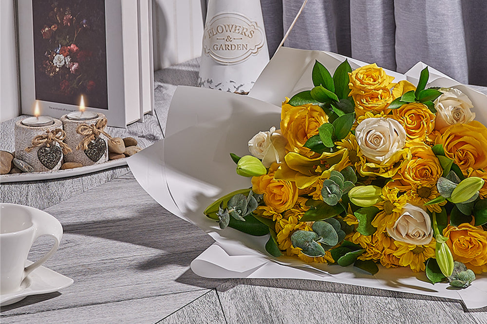 Finished floral arrangement prepared for delivery by Heart & Thorn